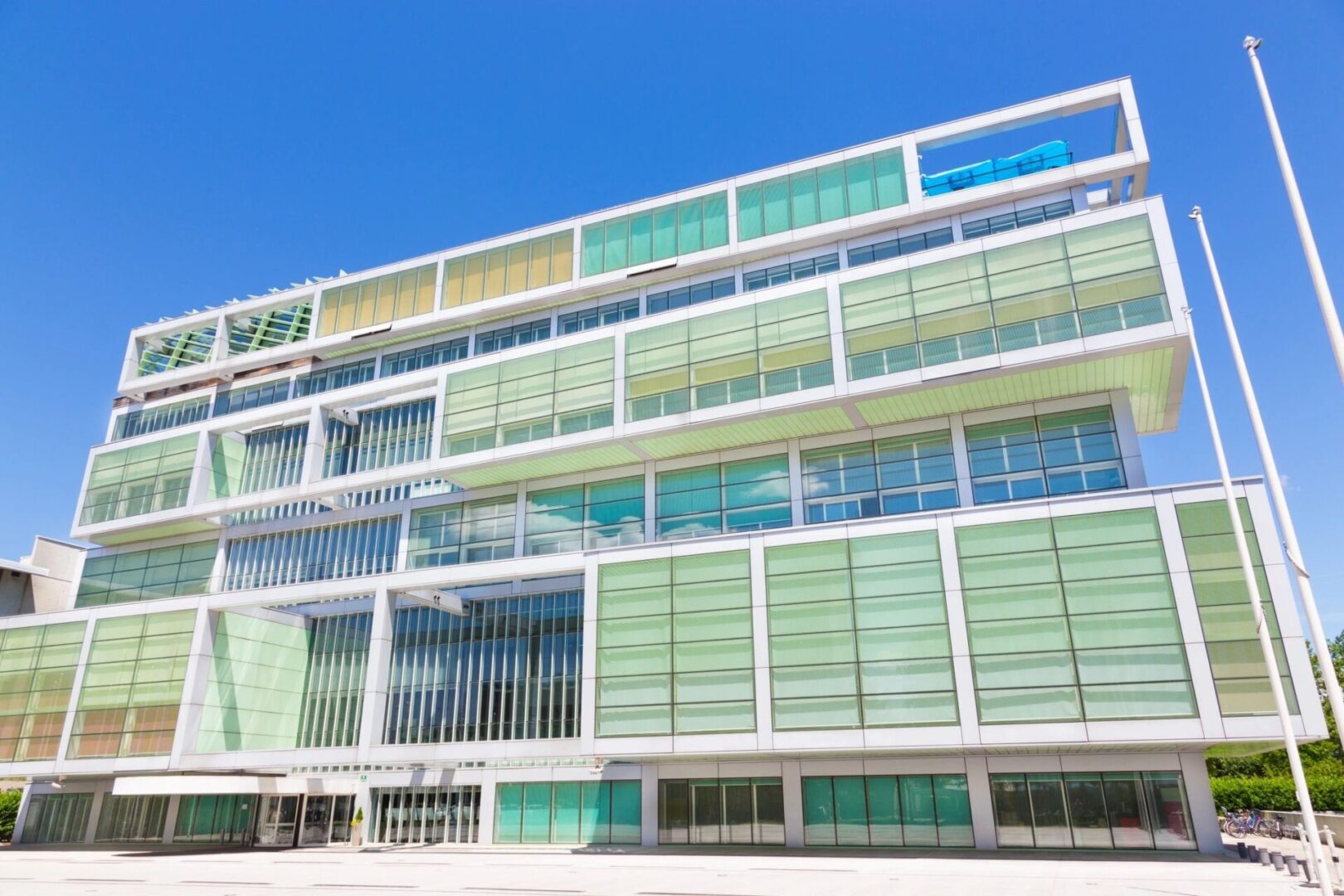 A large building with many windows and glass.